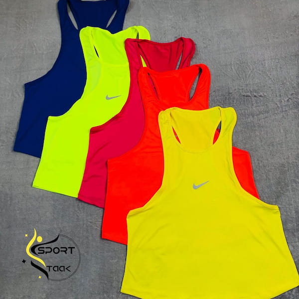 عکس-ست لباس ورزشی زنانه کبریتی نایک زرد